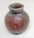 small raku vase with ancient petroglyph design. 7.5 x7cm. £19